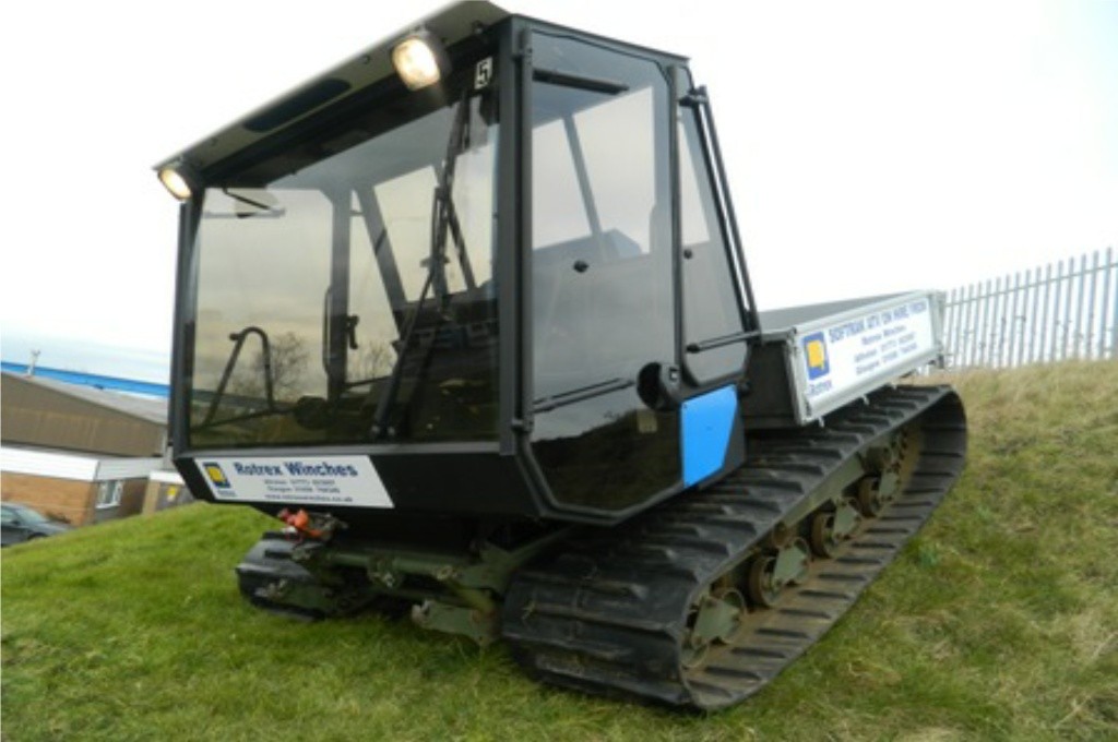 Softrak ATV going down a grass slope