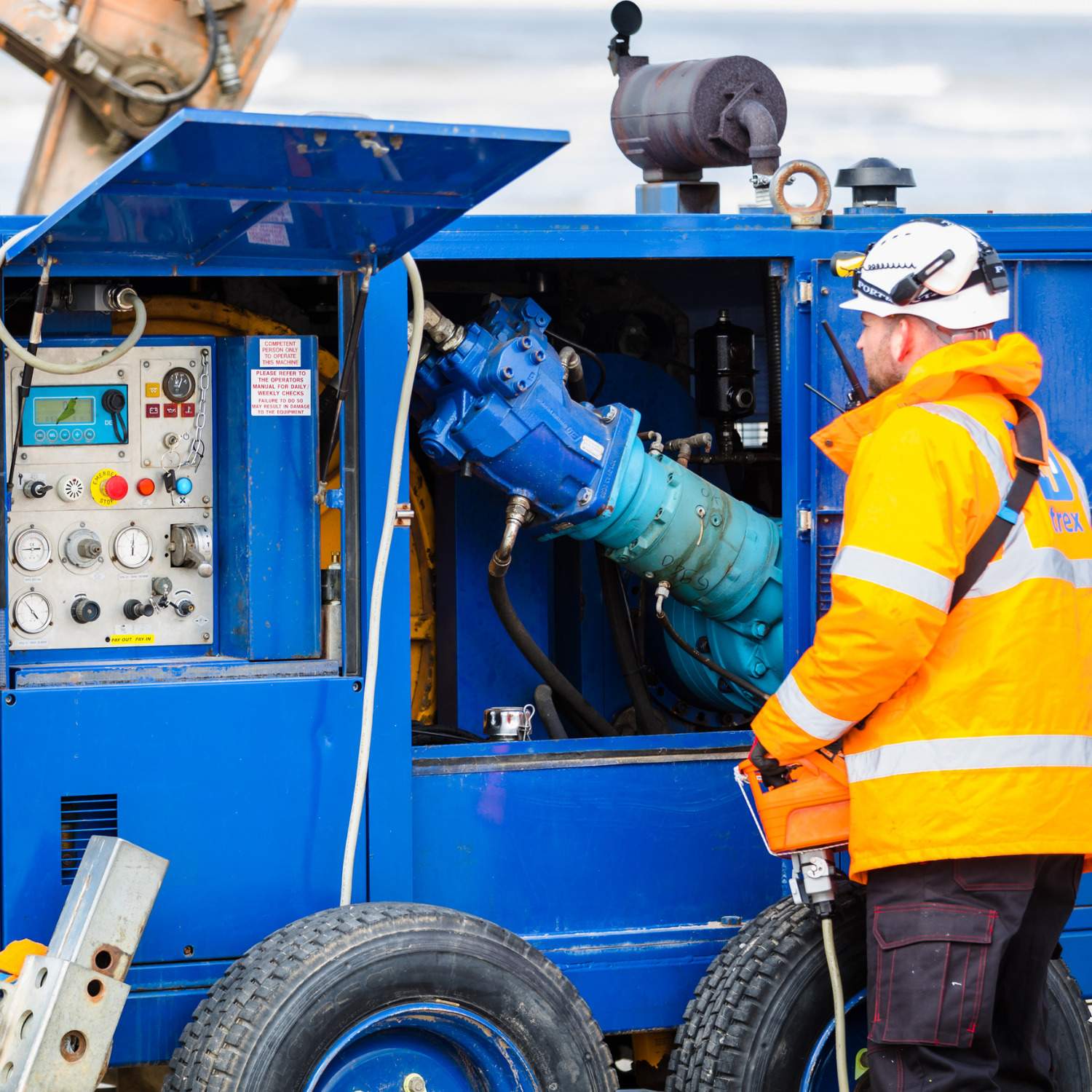 Engineer examining the internal workings of a winch