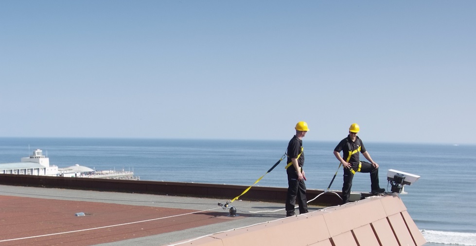 Rotrex Onsite training, two people stood on roof with harnesses